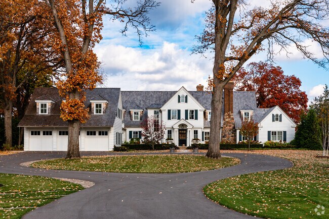 Residents of Orchard Lake Village enjoy large homes surrounded by dense old growth trees.