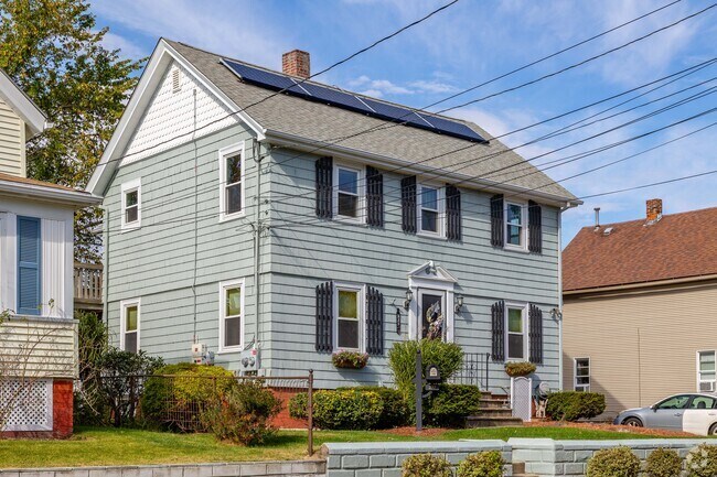 Colonial style homes have shutters with some having solar panels in Auburn.