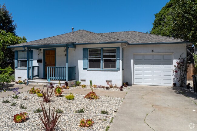 A classic Minimal Traditional in Casanova Oak Knoll with blue trim and a tidy gravel front yard.