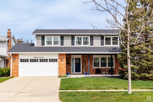 Bi-level home style with a large front porch and attached garage is located in Mount Shire.