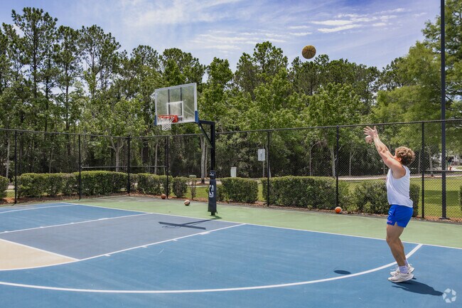 Rivertowne residents enjoy shooting hoops on the basketball courts at the Amenity Center.