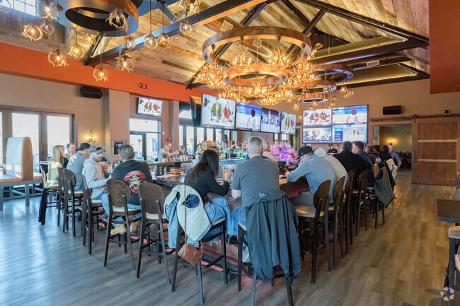 The bar at the Olde Silver Tavern is a popular spot to relax after work and enjoy live music near Lafayette Mills.