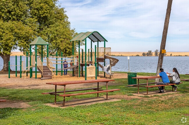 Kids enjoy the playground at Lake Yosemite County Park in Merced.