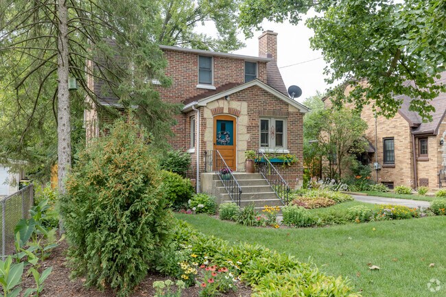 Quaint cottage-style home with mixed stone and brick exteriors located in Warrenville.