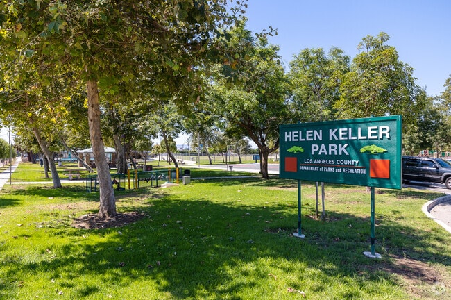 Helen Keller Park in Athens, CA offers multiple playgrounds, a pool, and a basketball court.