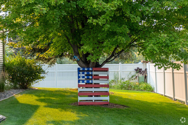 A patriotic pallet leans on a tree in Southpointe.