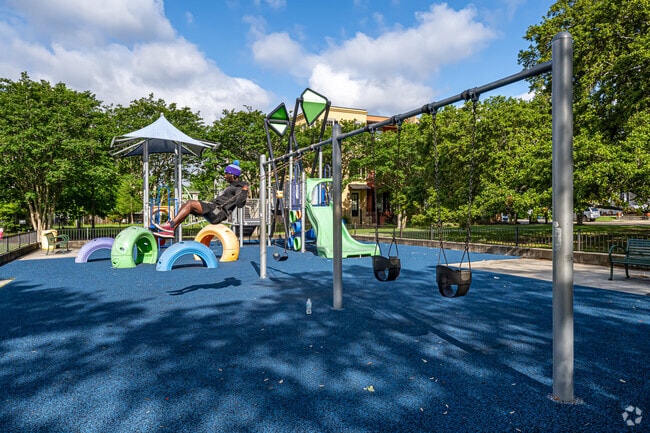 Samuel Square has swings to swing on.