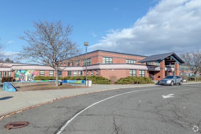The John F. Kennedy Middle School in Northampton has a B rating from Niche and colorful murals.