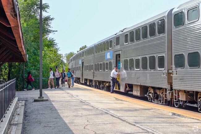 Students head to class from the College Avenue station near Downtown Wheaton.