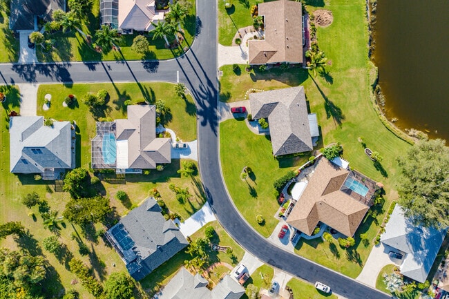 Many single family homes in Jacaranda West offer backyards with private pools.