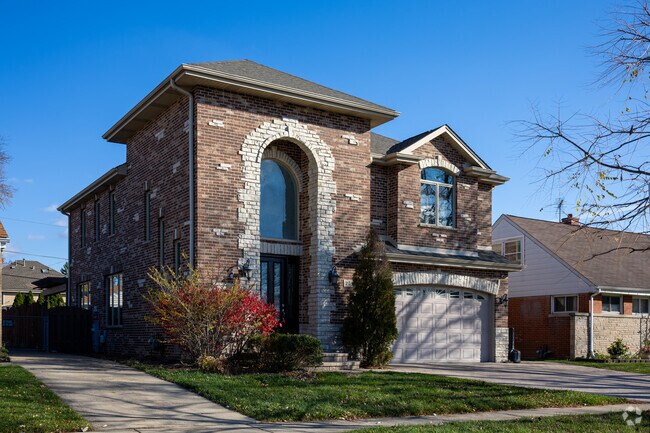 There are impressive custom builds in Oasis, like this brick home with a two story entry.