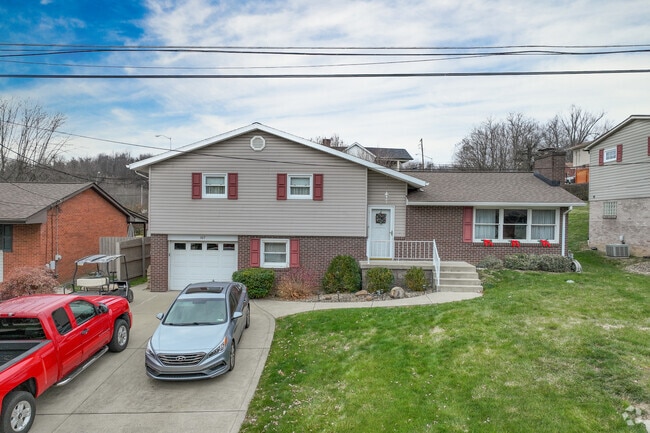 A split-level home in Rostraver Twp with a garage.