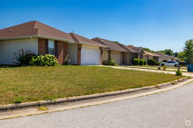 A row of newer built ranch homes sit snuggly along a neighborhood street in Bissett.