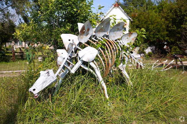 A stegosaurus sculpture stands at Jurassic Art, a quirky roadside attraction in Rose Hill.