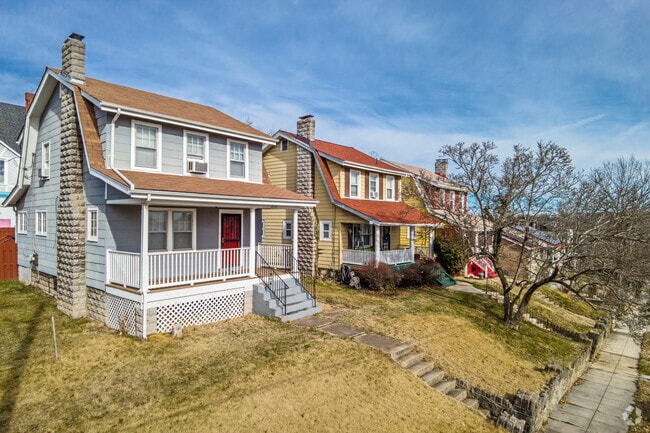 Homes in the Langdon neighborhood are often perched on small hills away from the sidewalk.