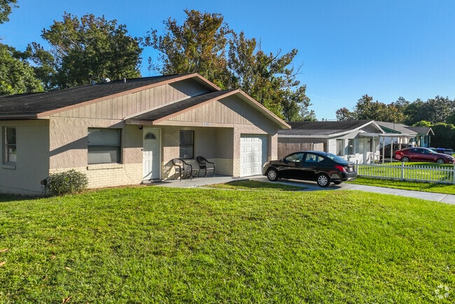 Well-manicured lawns reflect pride of ownership in this row of West Colonial homes.