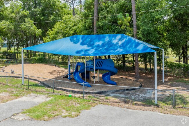 Younger students play on the jungle gym at Newberry Elementary.