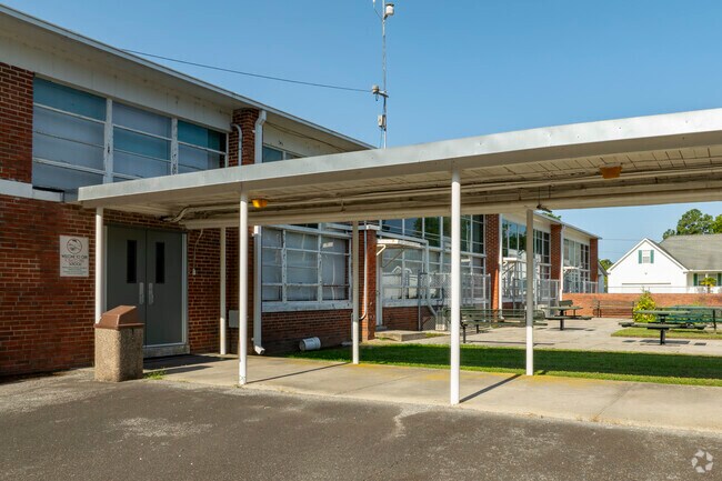Students enjoy outdoor dining and recreation areas at H.L. Trigg Community School.