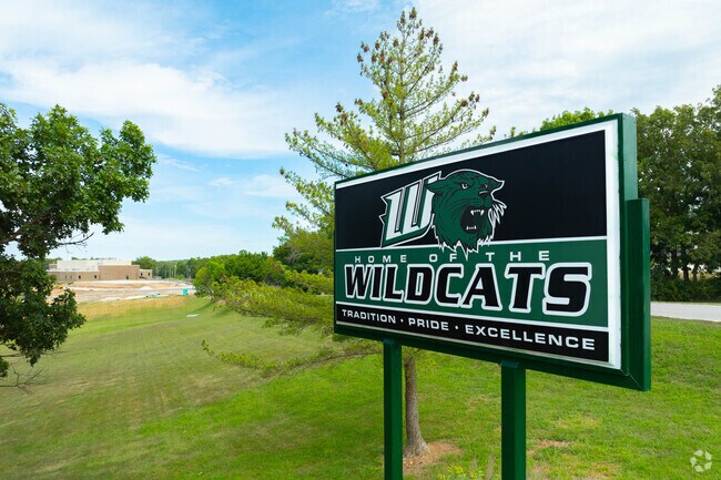 Warsaw Wildcats signage marks the high school entrance.
