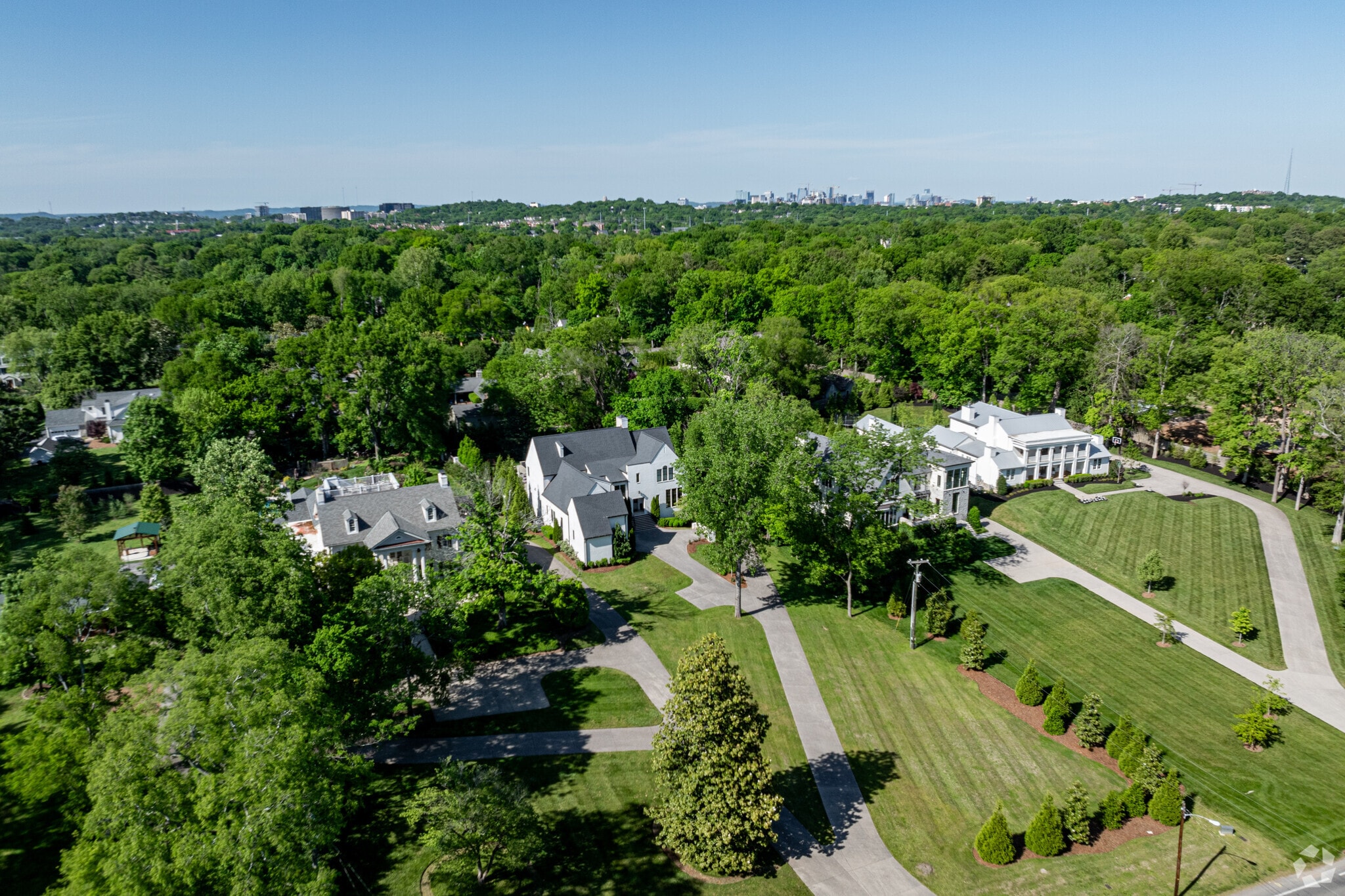 Large homes of shapes and styles can be found on Woodmont Blvd in Green Hills.