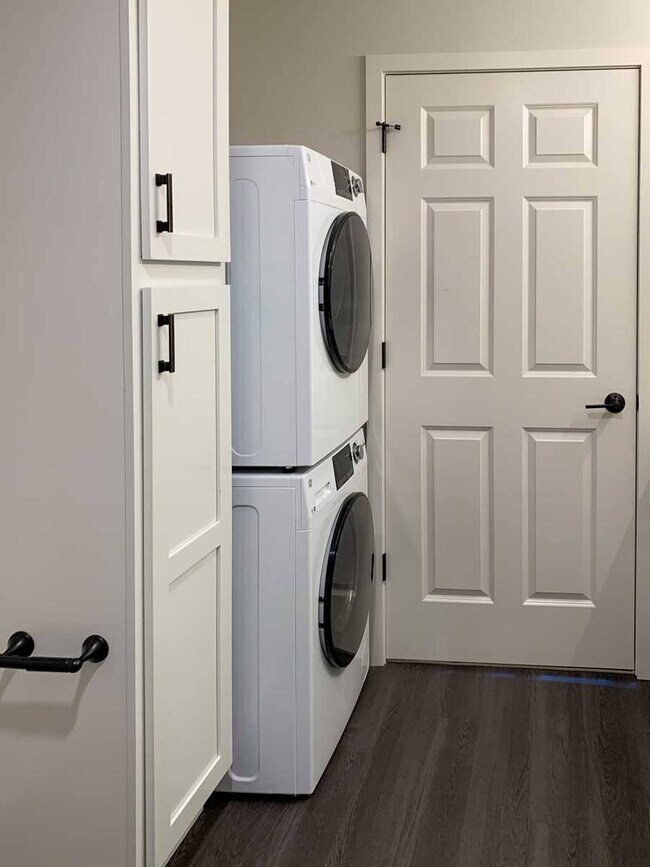 Tucked-away stackable washer and dryer add convenience and functionality to your home.