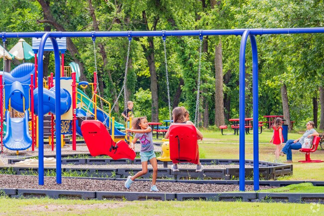 Children thoroughly enjoy playing on the swings at Goldsby Park.