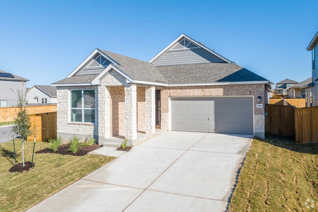 Single-story 3-bedroom home with a limestone facade graces Jarrell, Texas.