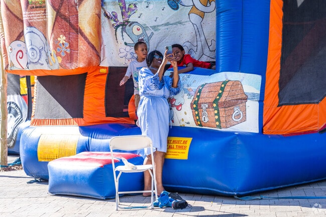 A family takes a selfie while playing at The BLVD Market in Central Lancaster.