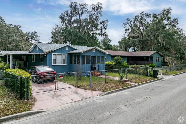 Sugarhill homes are set along quiet streets lined by moss covered trees.