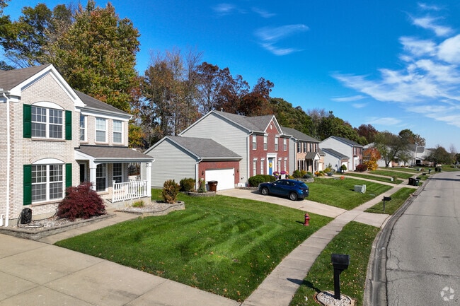 Homes in Amelia sit on sizable lots backdropped by tall trees.