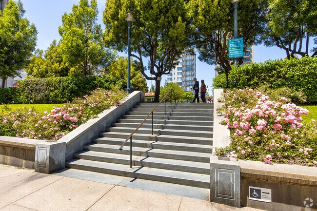 The entrance to Huntington Park is flanked by roses.