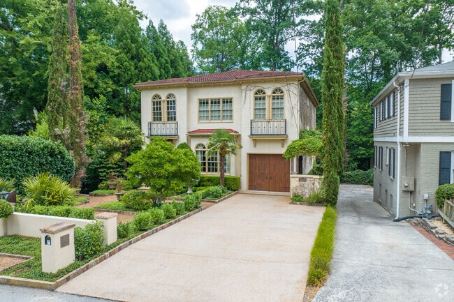 Some homes in Peachtree Heights East are backed onto wooded lots will long driveways.