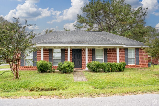 The columns on this French colonial make it a pleasant sight in Neely.