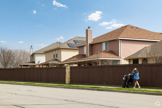 A mom taking the kids on a stroll through the safe streets of Cibolo.
