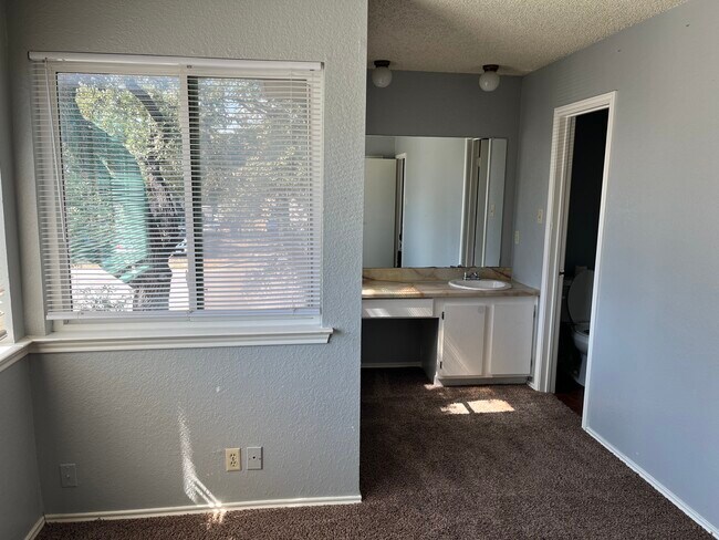Upstairs guest bedroom with sink