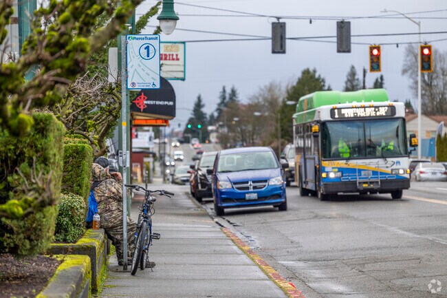 Pedestrian waiting on the bus in Central Tacoma.