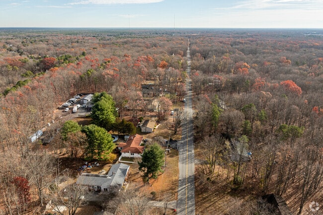 Chesilhurst is a rural neighborhood set among dense forests and connected by two-lane roads.