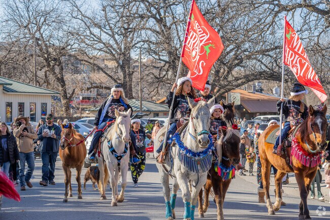 Medicine Park Christmas Parade & Carnival draws MacArthur Park locals for fun.