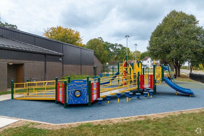 Families enjoy the playground at Sullivant Gardens Community Center in South Franklinton.