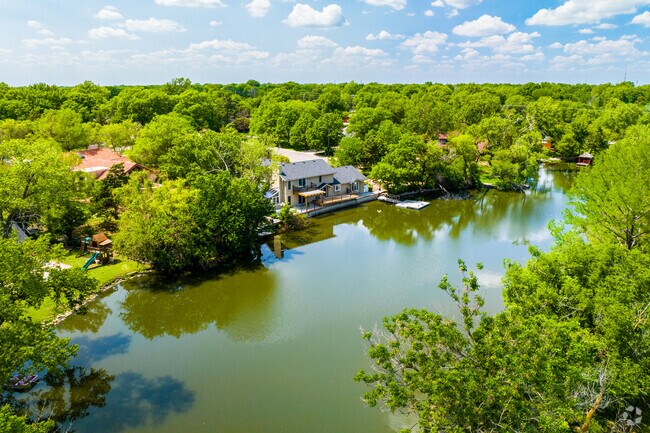 A few of the homes in New Day back up to a small lake.