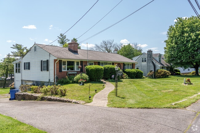 A ranch home sits next to a Cape Cod in Lima, reflecting varied local styles.