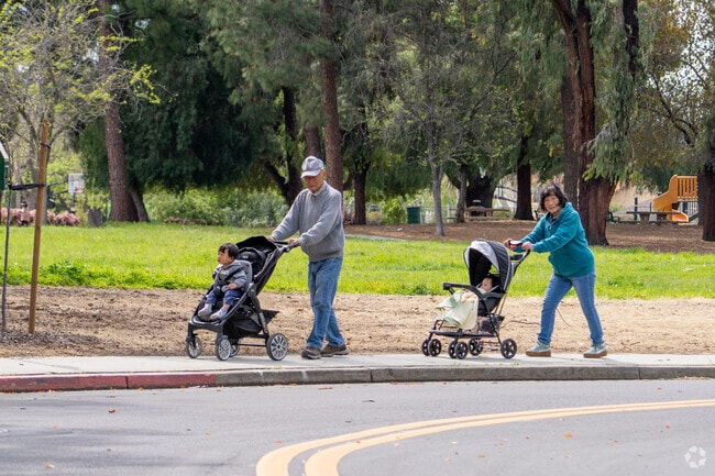 Families enjoy stroller walks along the tree-lined paths near Cataldi Park in Citaldi.