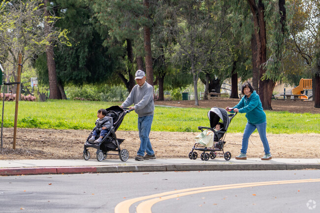 Families enjoy stroller walks along the tree-lined paths near Cataldi Park in Citaldi.