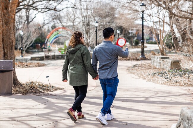 A couple enjoys a stroll through Botanica Gardens, just down the street from Indian Hills.