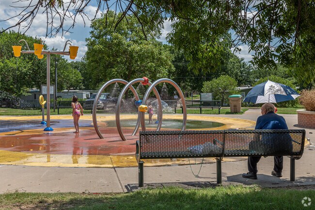 Neighborhood children enjoy the cool water at the Maxwell Park splash pad.