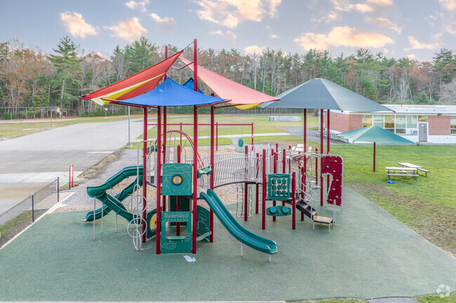 Eames Way School students enjoy recess at the jungle gym in Marshfield.