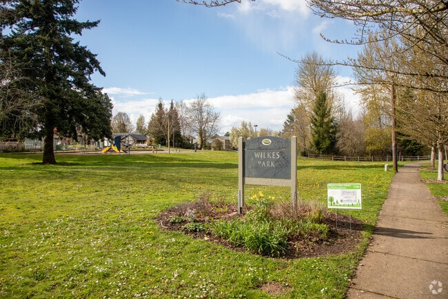 Wilkes Park Sign and Grassy Field in the Wilkes Neighborhood
