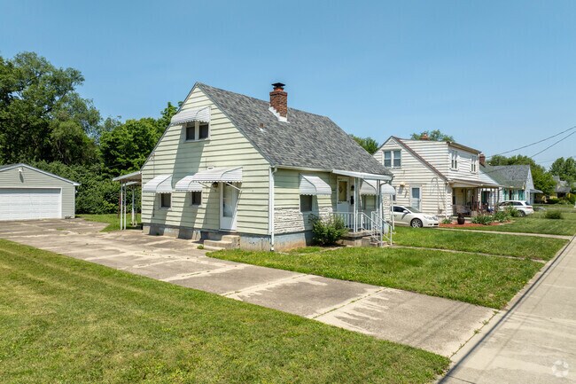 A row of Cape Cod-style homes located across from Douglass Park in the Douglass neighborhood.