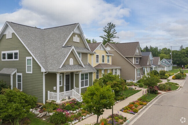 A colorful row of newer Craftsman-style homes on Virginia Ave in East Lansing.