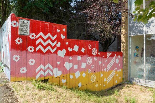 Bright murals cover fences at Bridges Middle School on SW 1st Ave in Portland.